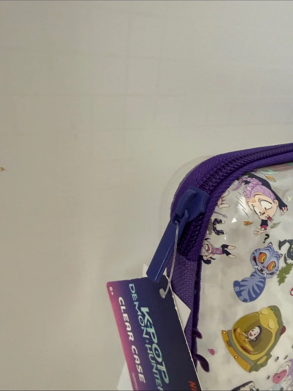 Netflix K-POP Demon Hunters Chibi-Style Clear PVC Pencil Case with Purple Trim.